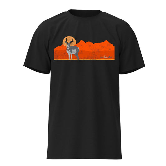 a black tee shirt with an antelope on the front in front of a mountain range and sun in orange and yellow