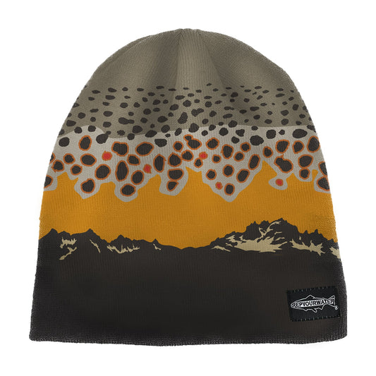 a skull cap beanie with brown trout as the top and a mountain range on the bottom