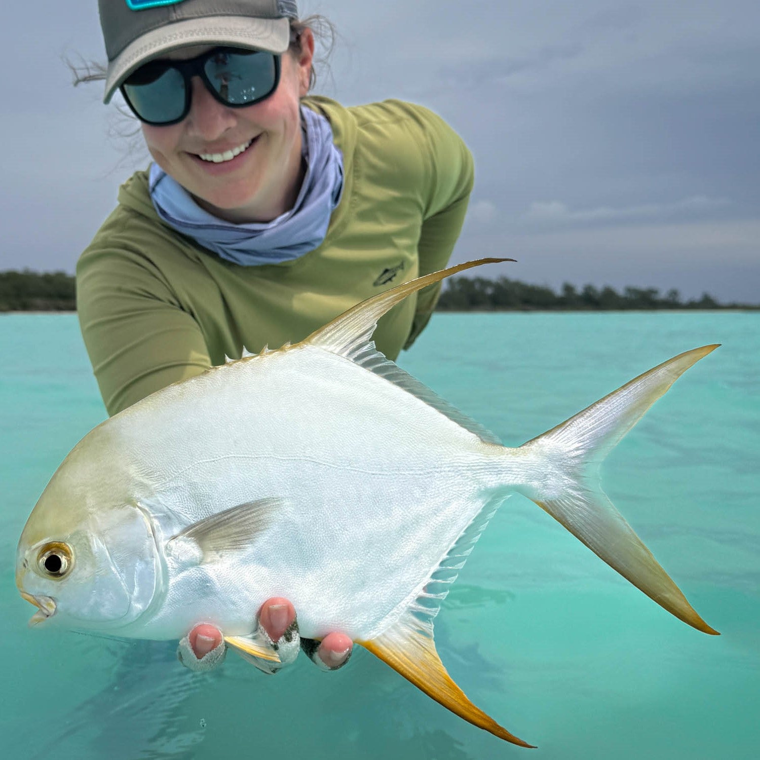 Corine holding a permit in the new sun hody