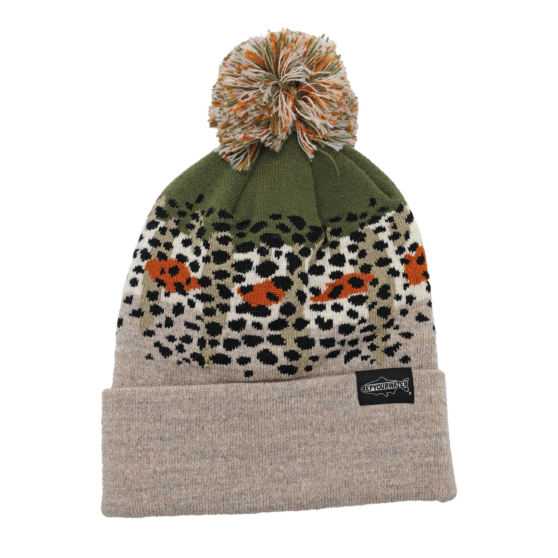 light tan beanie with a pom on the top and cuff. the design of the beanie is cutthroat trout skin pattern