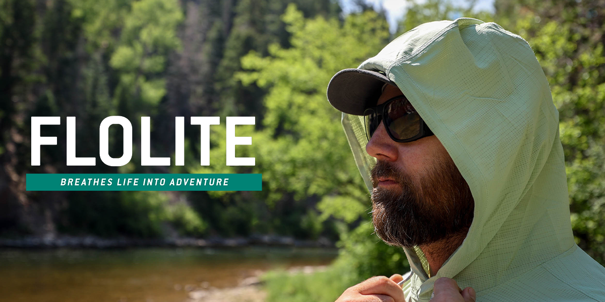 man in lichen RepYourWater sun hoody and sunglasses with Flolite text that reads breathes life into adventure