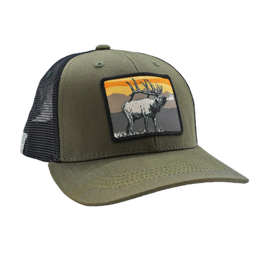 green hat with black mesh back and a patch on the front showing a bugling elk in front of a mountain range sunset 