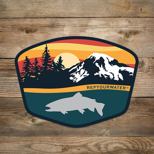 Sticker that shows sunset colors on a mountain range with tree silhouettes. a trout silhouette at the bottom and the words rep your water