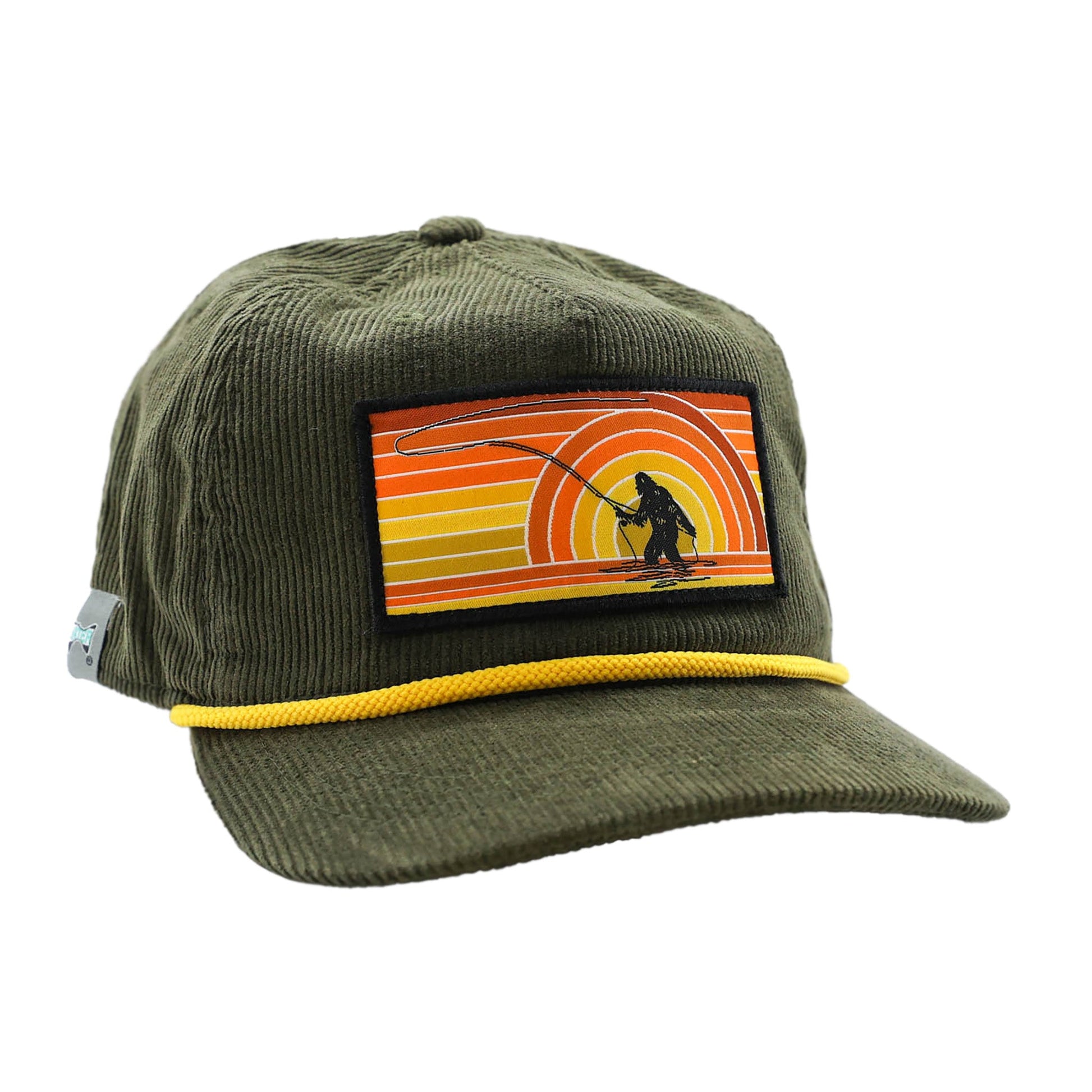 full cloth green corduroy hat with yellow robe and patch on the front showing sasquatch casting a fly rod and retro shades of orange and yellow background