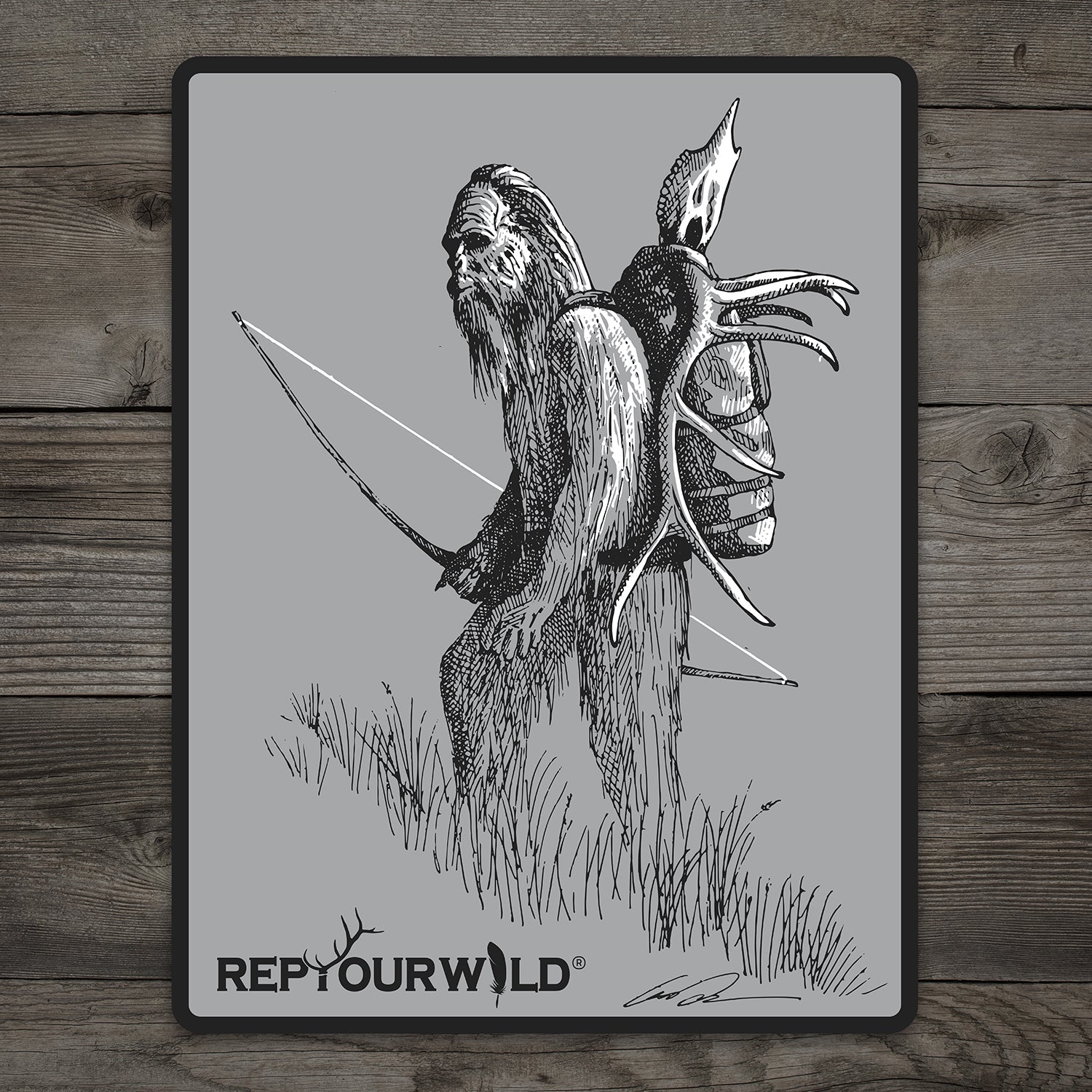 rectangular gray sticker with pen and ink drawing of sasquatch carrying a bow and elk head on his back
