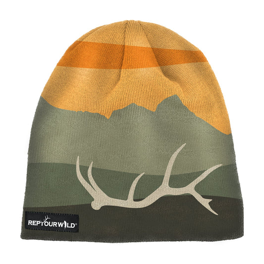 skullcap with a sunset and mountain range with an elk antler in white